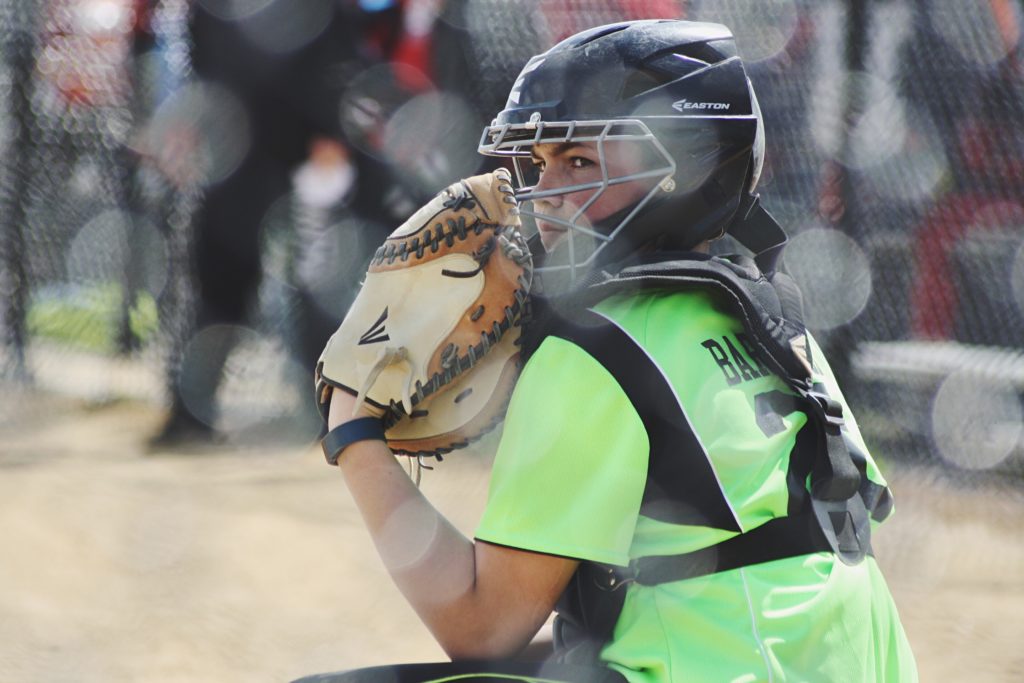 What do college softball scouts look for?